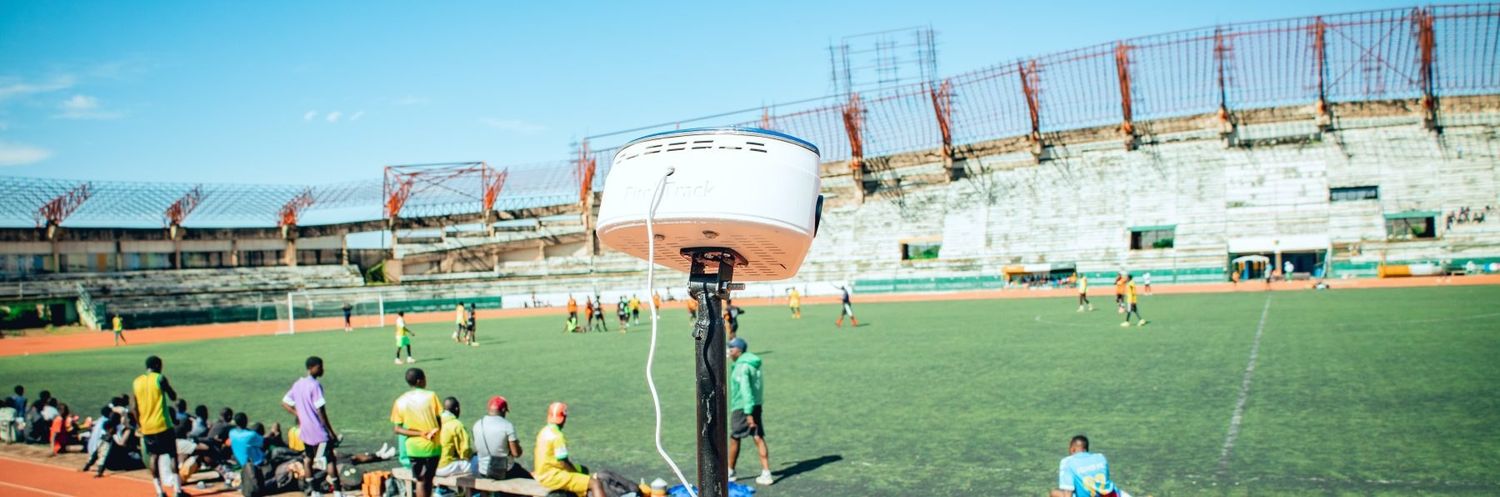 The PitchTrack rig on a mast at the halfway line, with a match in progress behind it